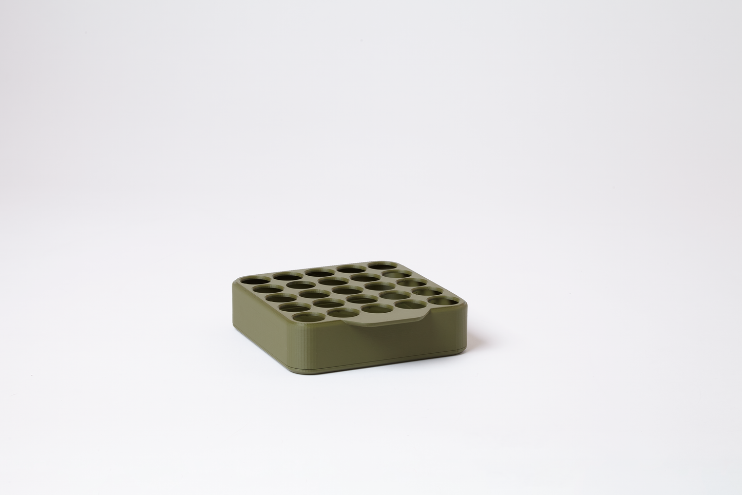 Empty vintage military green grid display for 22mm pre-roll tubes, holds 25 tubes in 5 rows