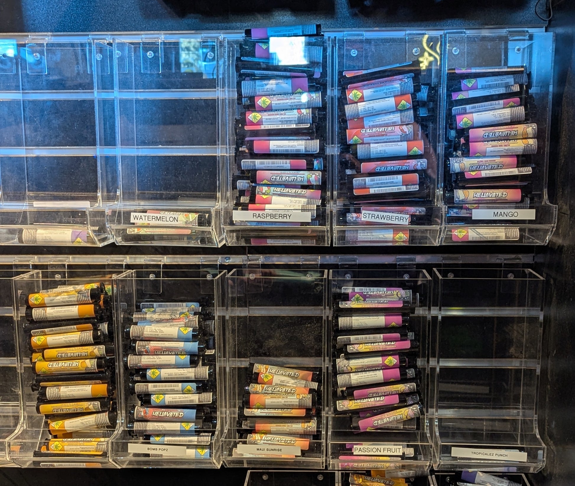 Standard acrylic slatwall display holding 10 pre-roll products across 8 rows
